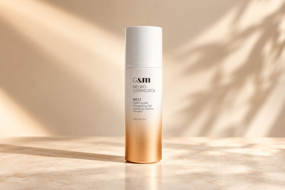 Ginger & Me | Neurocosmedics No. 1.1 Nutri-Luxe Cleansing Oil bottle on a warm beige background with soft natural sunlight.