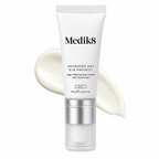 Medik8 Advanced Day Eye Protect 15ml age-defying eye cream with sunscreen in a white tube with silver pump, displayed against a creamy product texture on a white background.