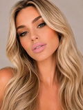 Model wearing SUZY Miss Amy Baby Pink Whipped Matte Lipstick, featuring a soft baby pink lip colour with a smooth, creamy matte finish.