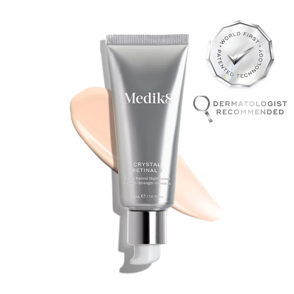 Medik8 Crystal Retinal 3 Night Serum 30ml silver tube with cream texture swatch, patented technology badge and dermatologist recommended label.
