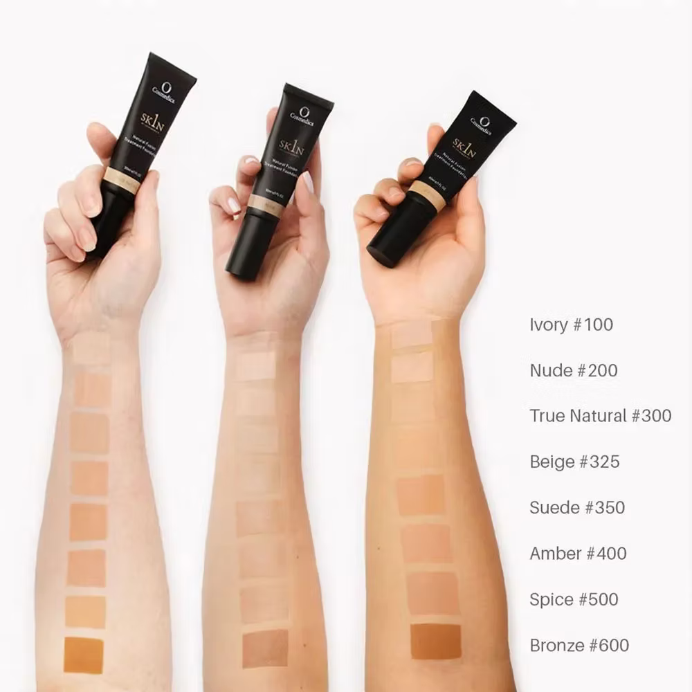 O Cosmedics 1SKIN Treatment Fusion Foundation shade range showing foundation tubes and complexion swatches