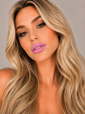 Model wearing SUZY Cotton Candy whipped matte lipstick in a soft playful pink shade
