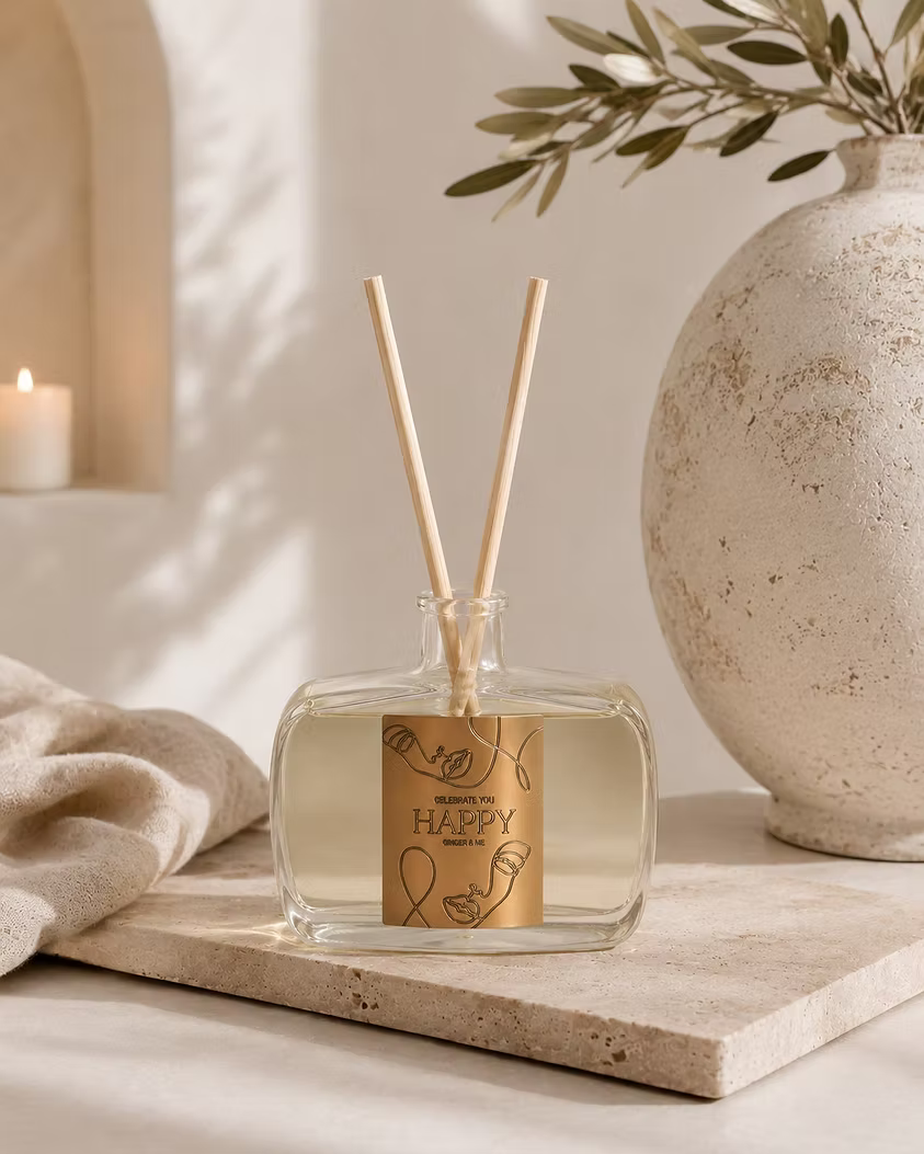 Ginger & Me Happy Reed Diffuser displayed in a neutral home interior with decorative accessories and natural styling