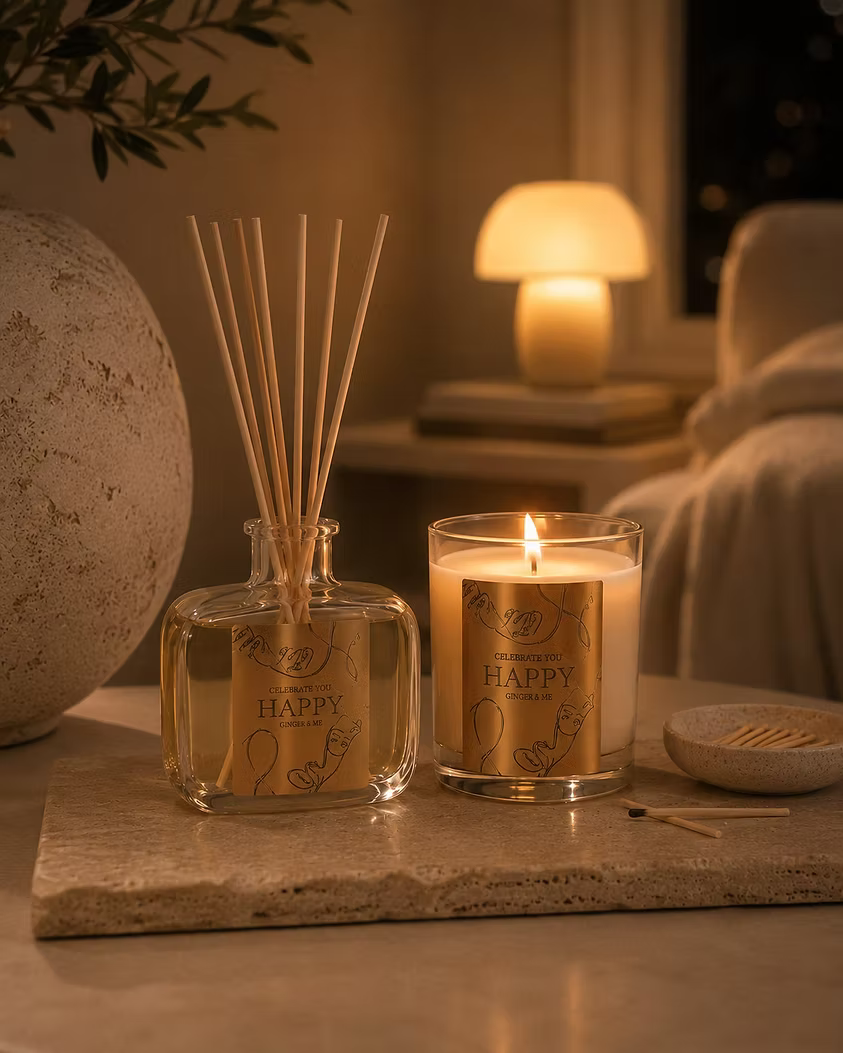 Ginger & Me Mindfulness Reed Diffuser styled in a warmly lit interior with candles and elegant home fragrance decor.