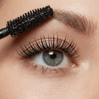 Close-up of long, full-looking eyelashes and defined eyebrows showcasing lash and brow beauty