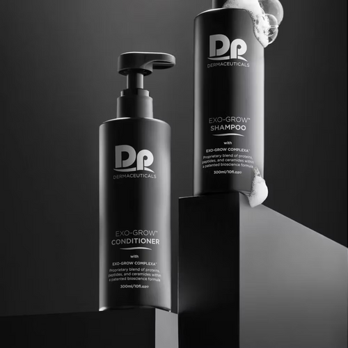 DP Dermaceuticals EXO-GROW Conditioner and Shampoo 300ml bottles displayed together in a premium black studio setting with cleansing foam.