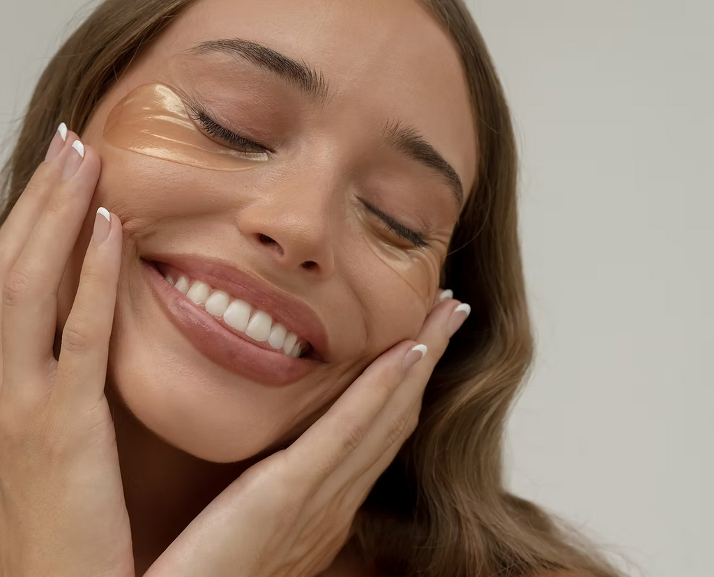 Smiling woman with radiant, hydrated skin showcasing the benefits of Ginger & Me Hydra-Glow Eye Masks.