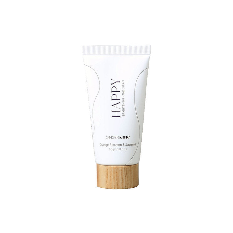 Ginger & Me Happy Brightening Hand Cream 50ml in white tube with wooden-look cap on a white background.