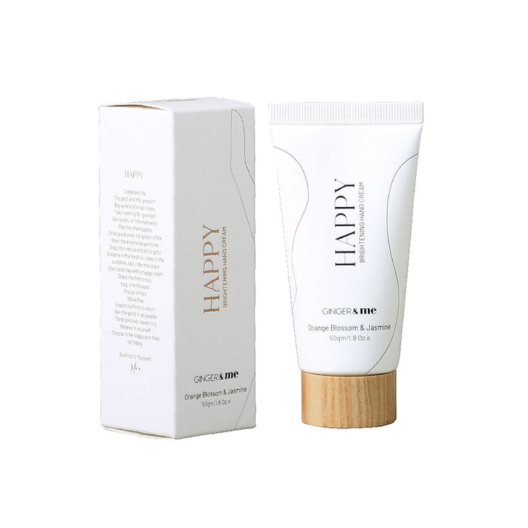Ginger & Me Happy Brightening Hand Cream 50ml tube displayed beside its white retail packaging.
