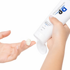 DP Dermaceuticals Micro Derm Exfoliant facial scrub being dispensed onto fingertips