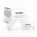 Medik8 Advanced Night Eye 15ml rejuvenating eye cream in an open white jar with lid and product packaging, showing the rich cream texture on a white background.