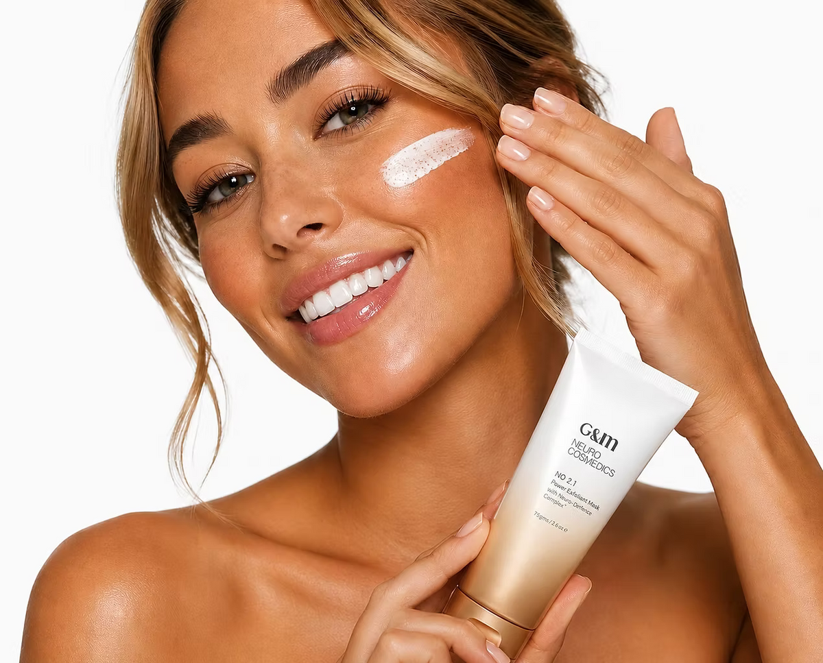 Woman applying Ginger & Me Power Exfoliant Mask to her cheek as part of her facial skincare routine
