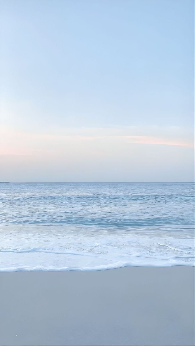 Soft blue ocean water beneath a pastel sky, reflecting the calm, minimalist aesthetic of Salt and Light Official.