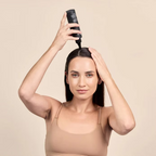Woman applying DP Dermaceuticals EXO-GROW Scalp Mask 150ml directly to her scalp using the applicator nozzle as part of a pre-shampoo haircare routine.