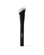 O Cosmedics 1SKIN Seamless Complexion Foundation Brush featuring a black handle and densely packed angled bristles.