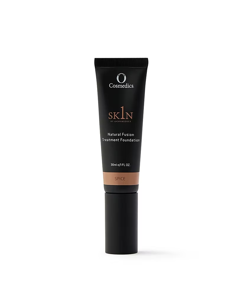 O Cosmedics 1SKIN Natural Fusion Treatment Foundation in Spice shade, 30 mL black tube with warm beige shade label, front product view on white background.