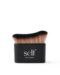 SELF Tan by O Cosmedics Luxury Self Tanning Brush with curved synthetic bristles and black handle.