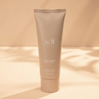SELF Tan by O Cosmedics Gradual Tanning Body Butter 200ml displayed against a warm neutral background