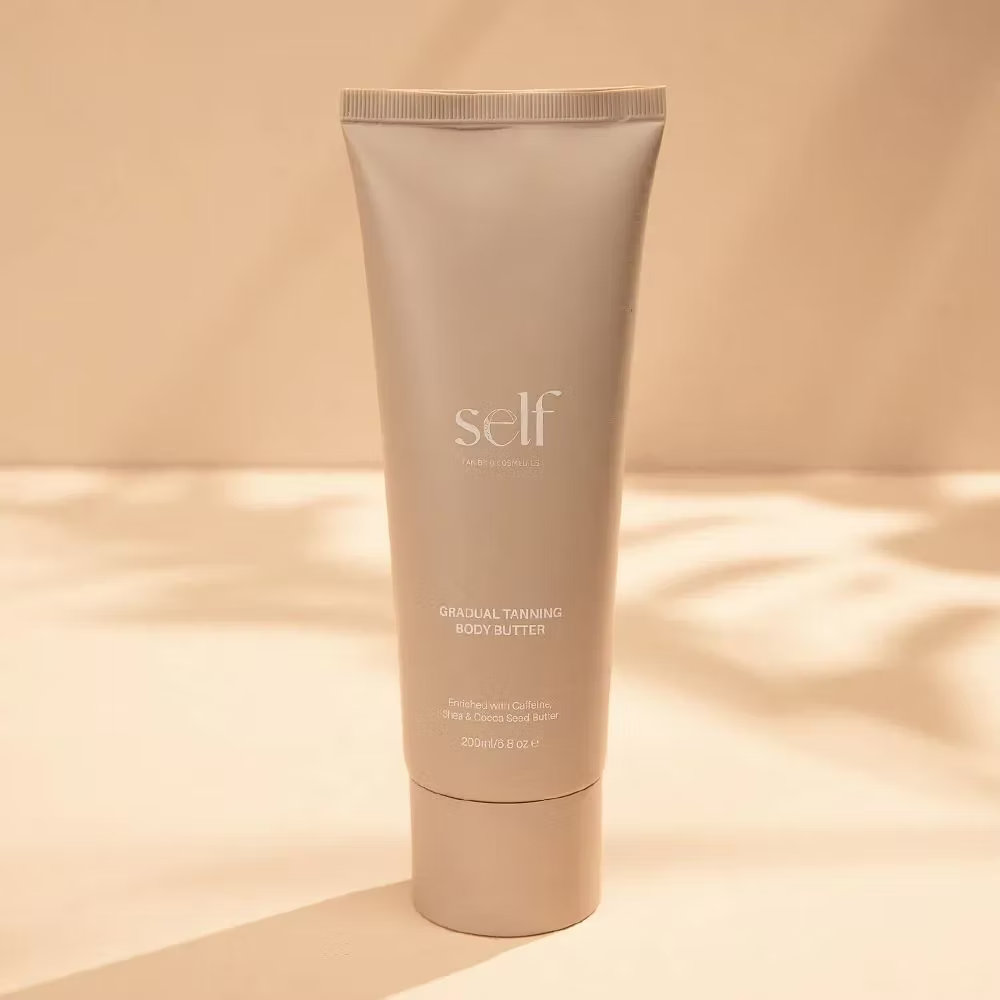 SELF Tan by O Cosmedics Gradual Tanning Body Butter 200ml displayed against a warm neutral background