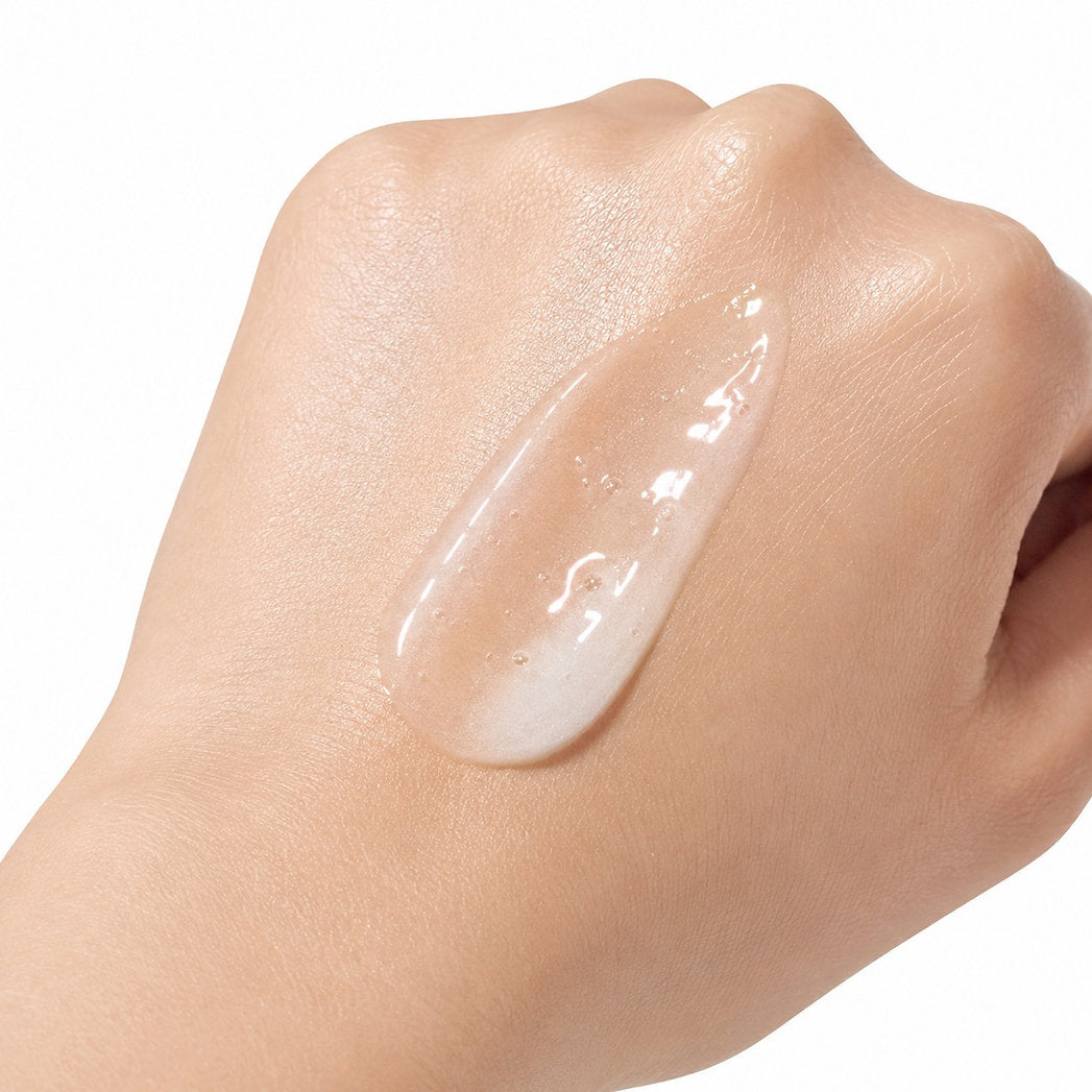 Close-up of DP Dermaceuticals Tri-Phase Cleanser texture applied to the back of a hand.