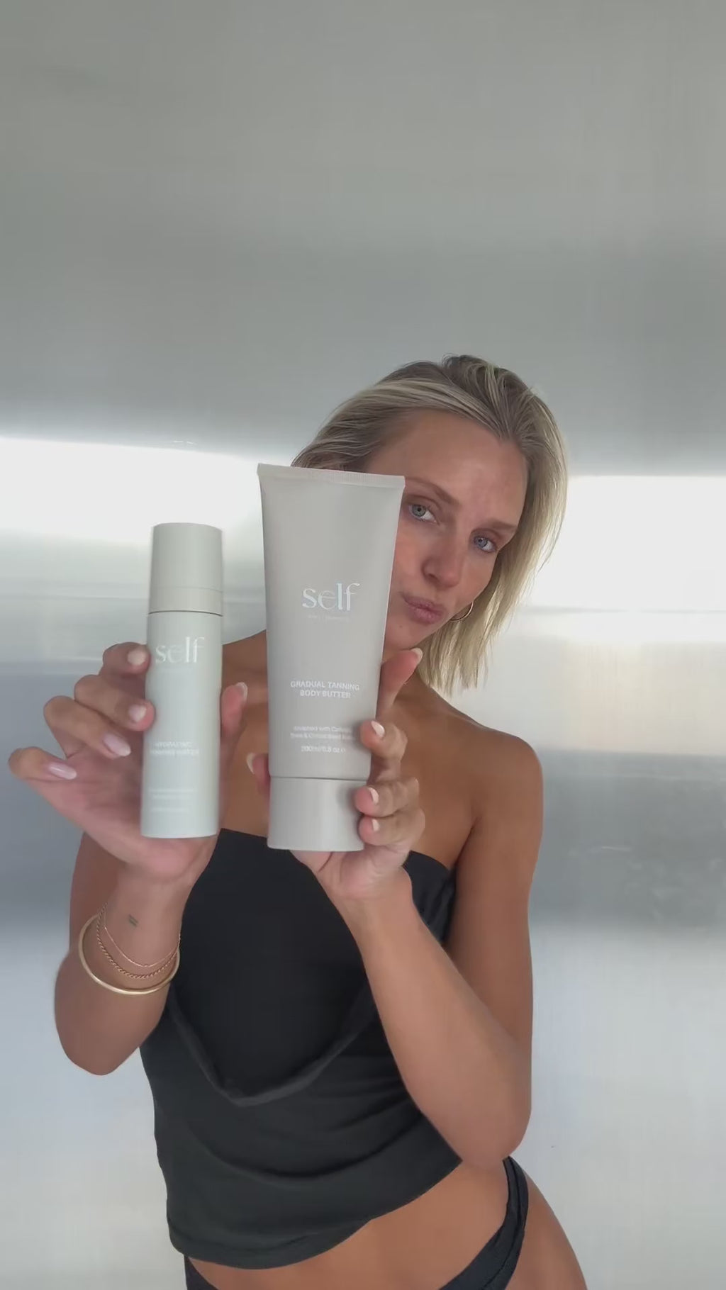 Model demonstrating her tanning routine using O Cosmedics Self Tanning products and accessories 